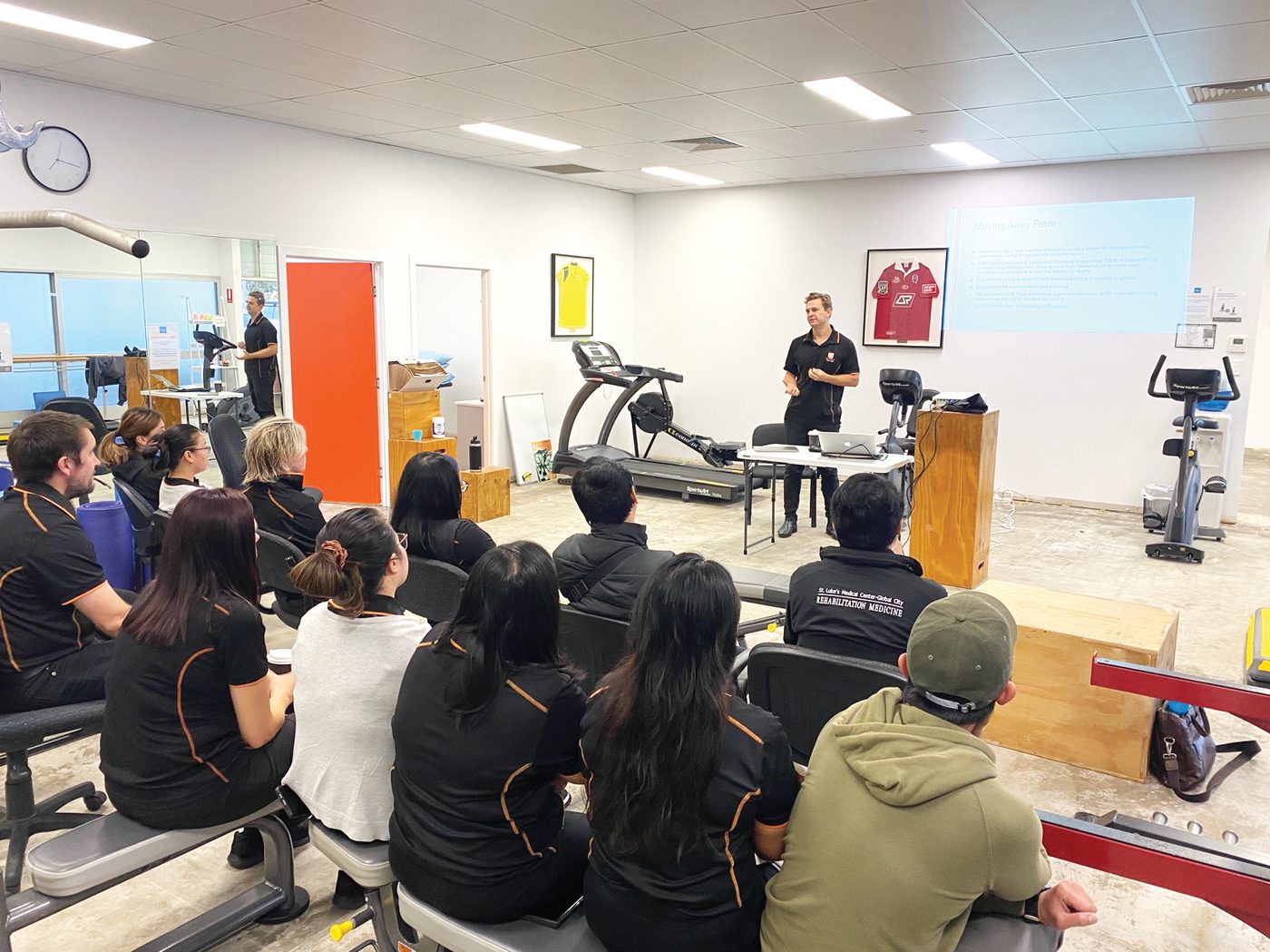 Optimum team training session in the Ballina clinic during flood repairs, on bare concrete floors